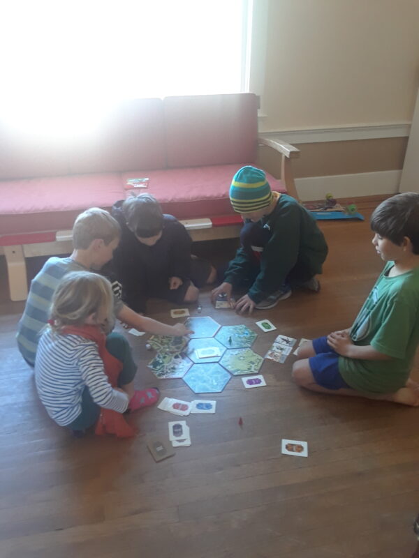 Kids Playing Legitimacy Board Game
