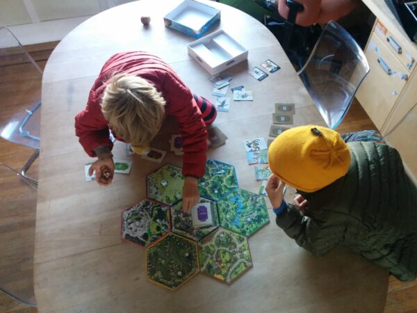 Kids Playing Legitimacy Board Game